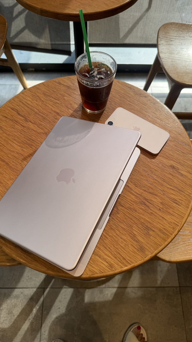 MacBook Neo on a desk with coffee cup