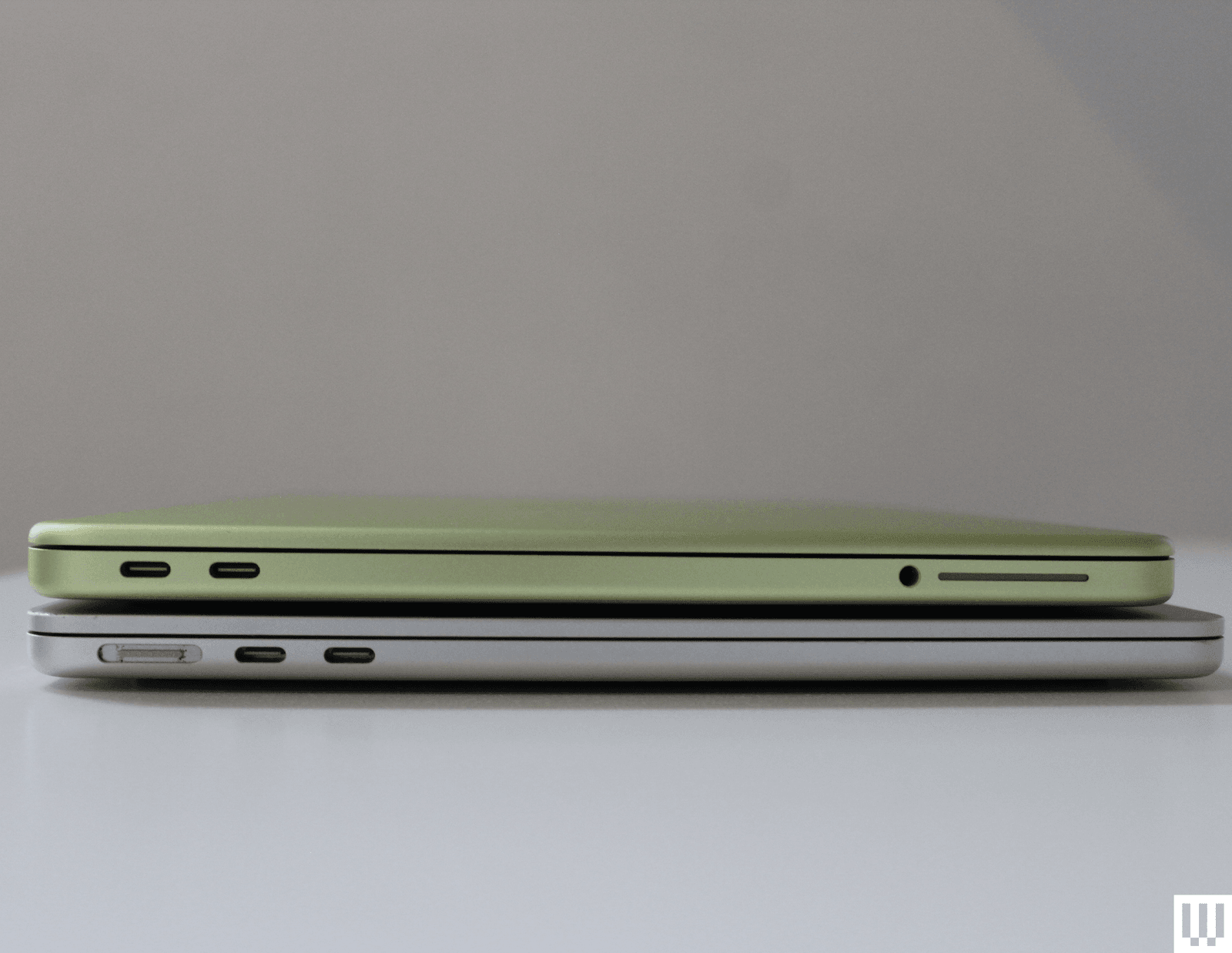 Side view of MacBook Neo showing its thin profile and recycled aluminum chassis