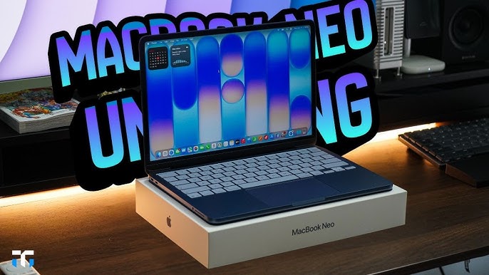 Apple MacBook Neo laptop showing indigo color variant on a desk