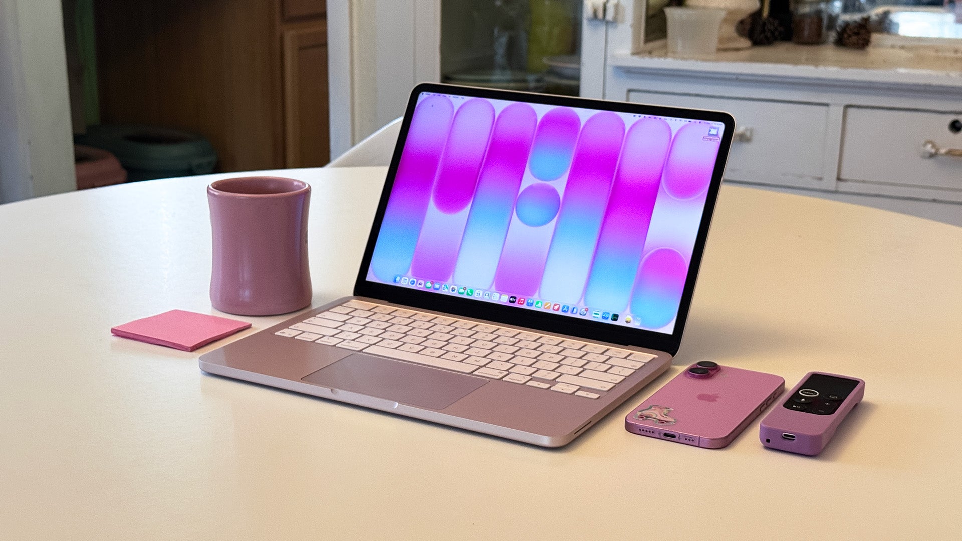 MacBook Neo in vibrant colors displayed on a modern desk