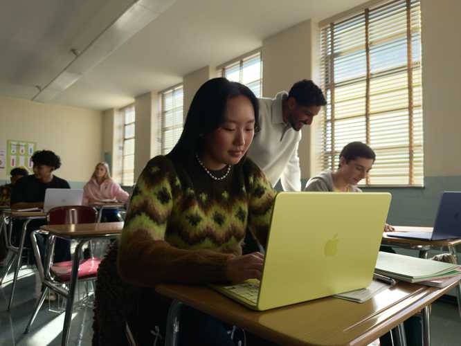 Student using MacBook Neo in a classroom setting